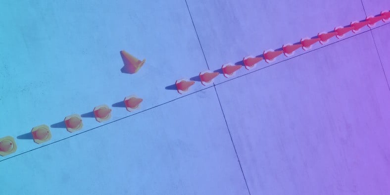 Image of a line of cones with one knocked over